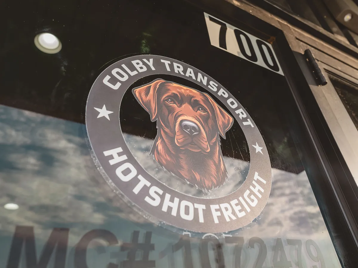 Colby Transport logo decal on the terminal entrance door.