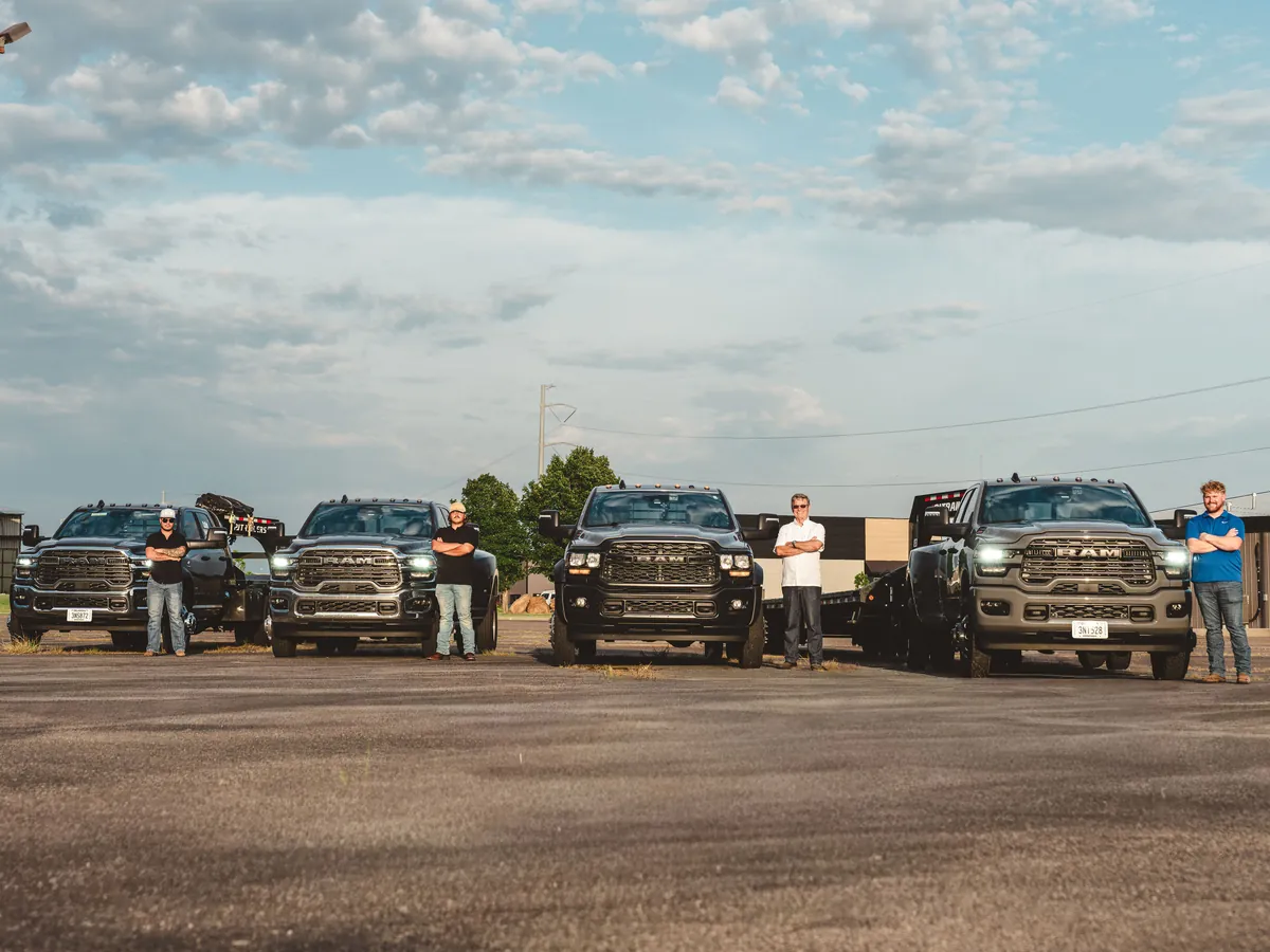 Colby Transport drivers standing with the fleet at the Oklahoma City yard.