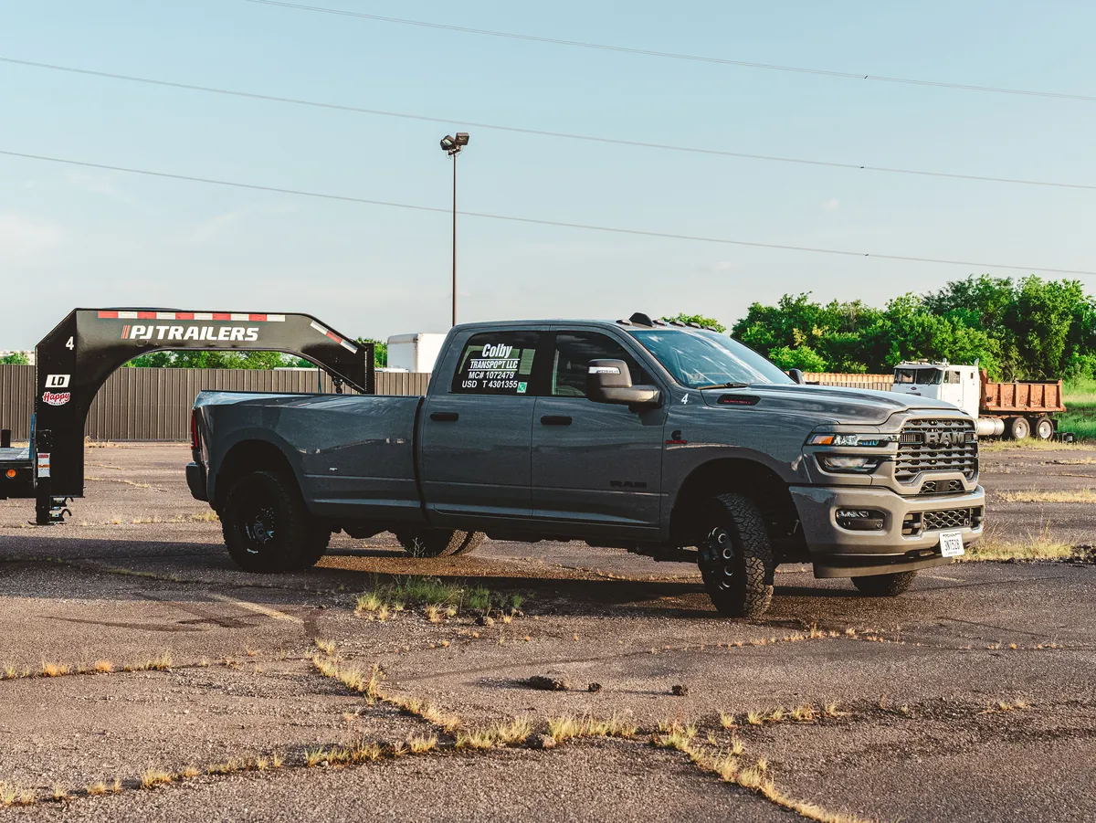 Side profile of a Ram 3500 coupled to a gooseneck flatbed.